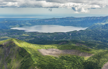Fototapeta na wymiar Crater Karymsky Lake. Kronotsky Nature Reserve on Kamchatka Peninsula.