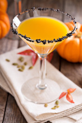 Pumpkin martini cocktail with black salt rim