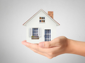 Fototapeta na wymiar Mortgage concept by house from hand