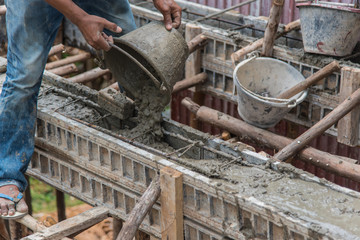 Concrete pouring during commercial concreting floors of buildings in construction(Commercial Building)