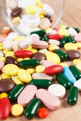 Fototapeta na wymiar Heap of colorful medical pills and capsules, health care concept