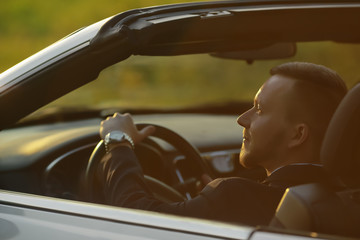 Portrait of a businessman, Businessman by car, portrait of a man, driving a convertible