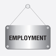 silver metallic employment sign hanging on the wall 