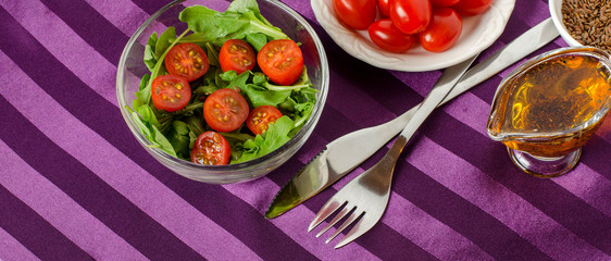 Vegetable salad on a purple background.