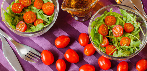 Breakfast for two with salad in salad bowls and Cutlery.