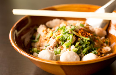 Selected focus meet ball Thai style spicy noodle tom yum