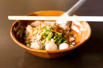 Selected focus meet ball Thai style spicy noodle tom yum