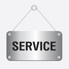 silver metallic service sign hanging on the wall 