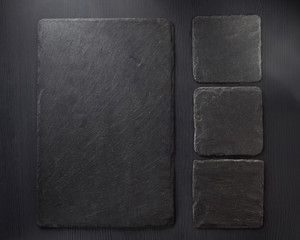  slate stone at wooden background