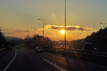 Fototapeta na wymiar Sunset on the roadway.