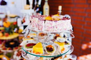 Elegance wedding reception table with food and cakes