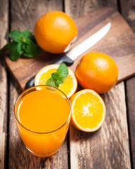 Fresh fruits Orange juice in glass on wood