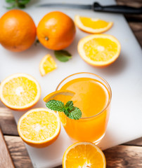 Fresh fruits Orange juice in glass on wood