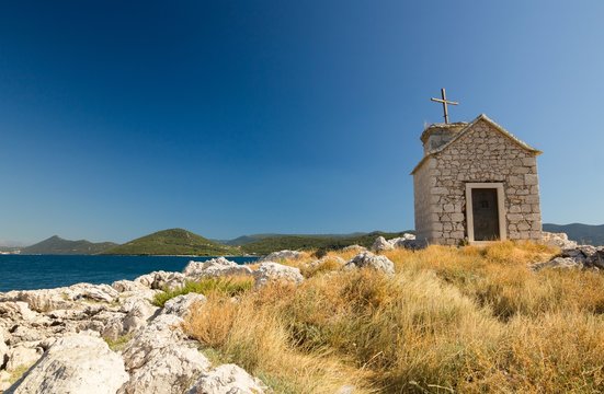 Small old stone church on island in Klek, Dalmatia, Croatia