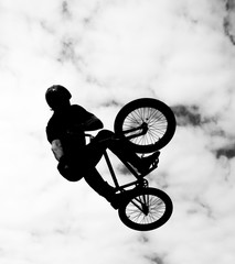 Silhouette of bmx rider in action