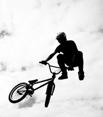 Silhouette of bmx rider in action