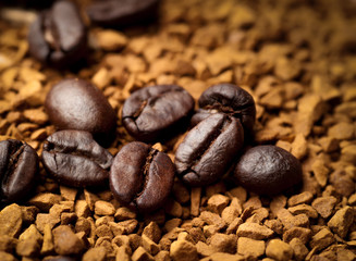 Coffee bean on ground coffee background.