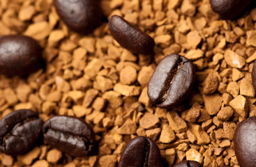 Coffee bean on ground coffee background.