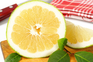 green grapefruit half and slice