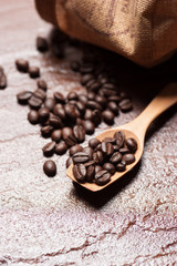 Coffee beans on a stone background.