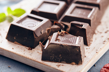 Dark chocolate on a white chopping board, light and bright colors