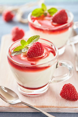 Panna cotta with rasperry and mint  topping with strawberry sauce