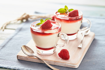 Panna cotta with rasperry and mint  topping with strawberry sauce