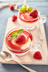 Panna cotta with rasperry and mint  topping with strawberry sauce