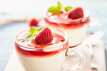Panna cotta with rasperry and mint  topping with strawberry sauce