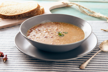 bean and spelt soup on a wooden table, bright colors