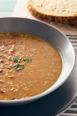 bean and spelt soup on a wooden table, bright colors