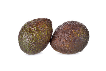 whole ripe avocado on white background