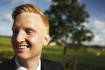 Redhead smiling young man