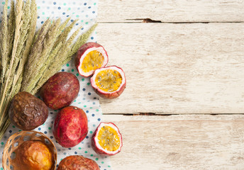 Passion fruits on wooden background