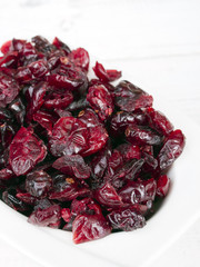 Dried cranberries in white bowl
