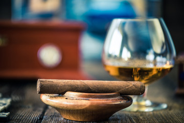 cuban cigar and glass of rum or cognac