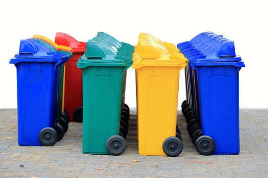 group of new large colorful wheelie bins for rubbish, recycling