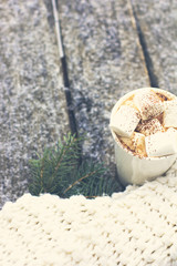 A cup of warm cocoa with marshmallows