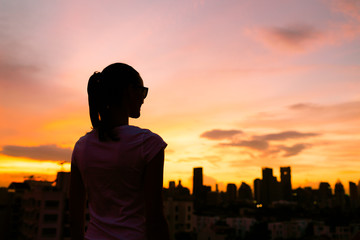 Fototapeta premium Young woman enjoying a peaceful moment in the city. 