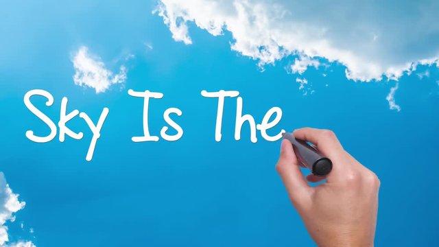 Sky is the limit concept with hand writing on the sky. Man writing. Blue sky with clouds time lapse.Sky is the limit circled. Business, technology, internet concept. 4k