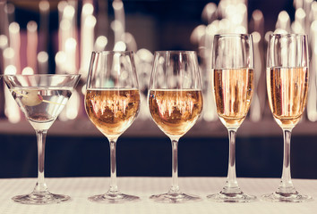 Assortment of alcoholic drinks in a party atmosphere. 