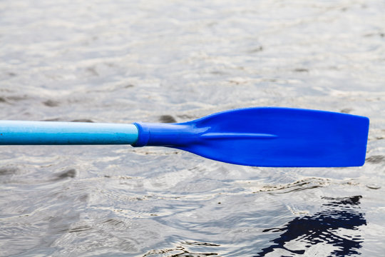 paddle blade over water during boating
