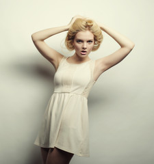 Fototapeta premium young magnificent woman in white dress.