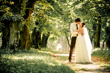 happy bride and groom on a walk in beautiful forest