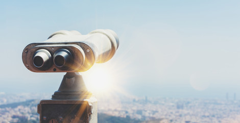 Touristic telescope look at the city with view of Barcelona Spain, close up old metal binoculars on background viewpoint overlooking the mountain, hipster coin operated in panorama observation, mockup - obrazy, fototapety, plakaty