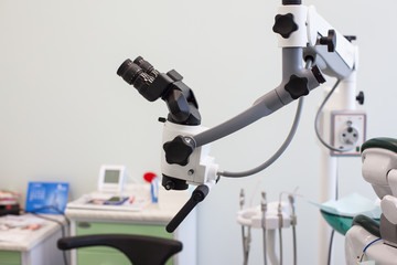 Professional binocular microscope for dentists in dental office 
