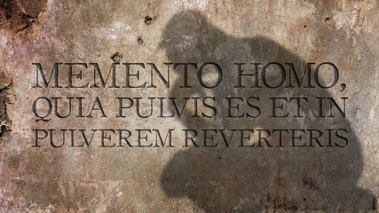 Memento homo, quia pulvis es et in pulverem reverteris. A Latin phrase that means Remember, man,...