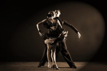 dancers in ballroom isolated on black background