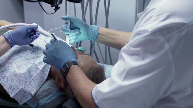 Process of filling of root canals with the help of modern equipment