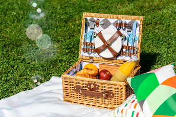 Picnic Basket Food On White Blanket With Pillows And Soap Bubbles